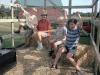 Sarah and the grandkids get a hayride as we return the neighbor's empty hay wagon.