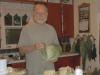 Bob working on the sauerkraut. Note the hanging bunches of herbs on the wall.
