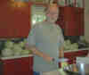 Bob cuts the cabbages small enough to fit into the food slicer mounted on the Bosch universal mixer.