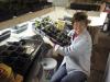 Sarah rotates the trays every twelve hours so that they get light.