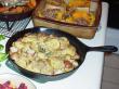 Sarah's rosemary potato dish baked in a cast iron skillet.