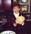 Sarah begins to pull loaves out of the dough.