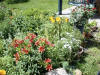 The porch swing overlooks the kitchen garden where you can watch the flowers bloom and the bees collect pollen.