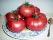 Some good looking Brandywine tomatos on a plate.