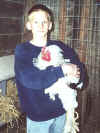 Charlie holding a very big rooster.