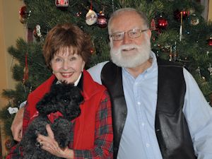 Bob and Sarah at home in front of the Christmas tree - 2009.