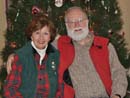 Bob and Sarah at home in front of the Christmas tree - 2009.