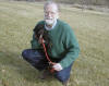 Bob holds Pilgrim during a break at a rest stop.