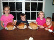 First batch of bread and lots of helpers.